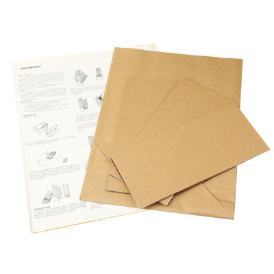 Kraft paper sheets with printed instructions for assembling a gift box