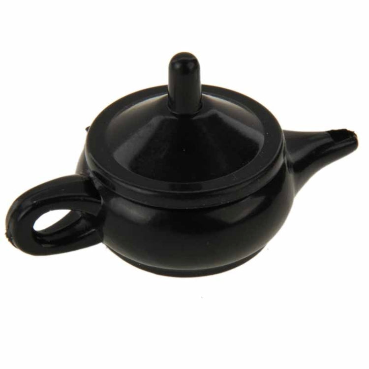 Black teapot magic prop with upright lid knob and curved spout
