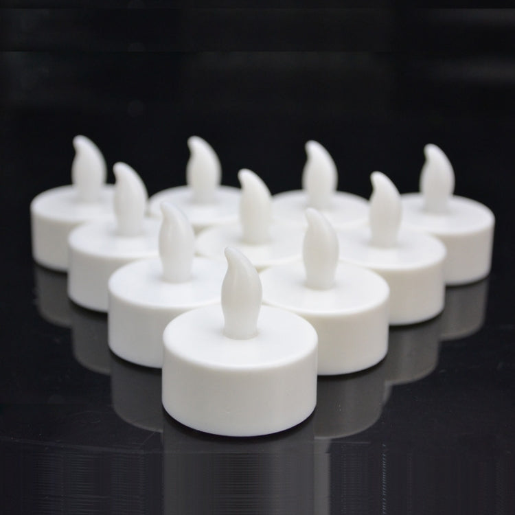 White flameless LED tea light candles with raised wick tops, unlit