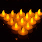 Orange flameless LED tea light candles grouped together, glowing flame effect