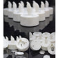 White LED tea light candles with bottoms shown, battery compartments and switches visible