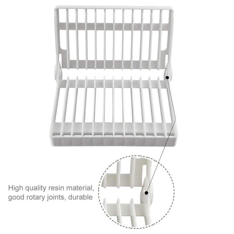 White foldable dish rack with two-tier slats and side locking tabs for stability