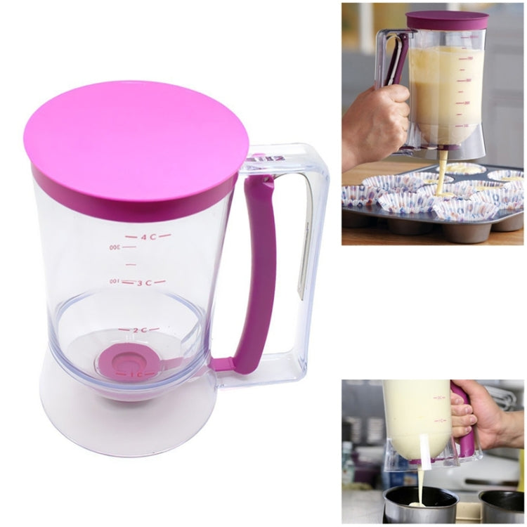 Pink-topped batter dispenser measuring cup with handle and red measurement markings