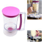 Pink batter dispenser measuring cup with purple handle and visible volume scale
