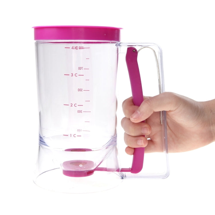 Clear measuring dispenser cup with pink lid, pouring lever, and red ounce markings