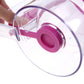 Close-up of clear batter dispenser cup tilting with pink bottom spout and handle