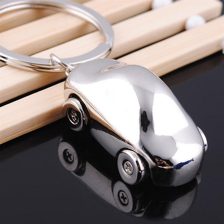 Polished chrome car-shaped metal key chain with key ring and wheel details