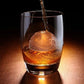 Star Wars Tellurion ice cube in a glass, shaped like a globe with panel lines