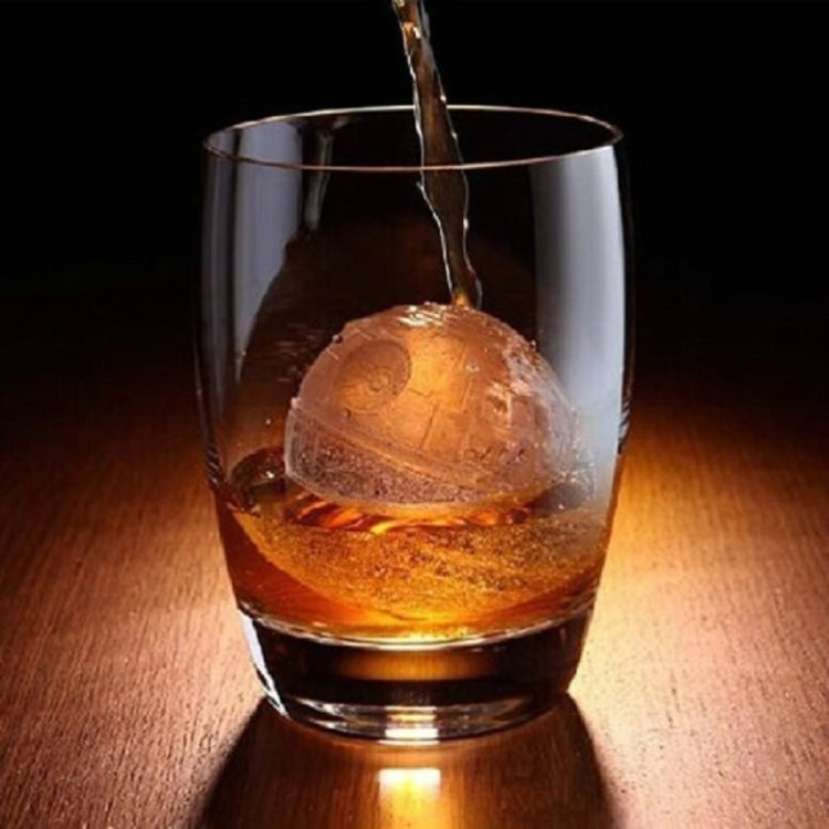 Star Wars Tellurion ice cube in a glass, shaped like a globe with panel lines