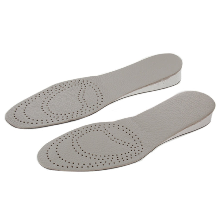 Pair of cowhide insoles with perforated arch and toe in light grey