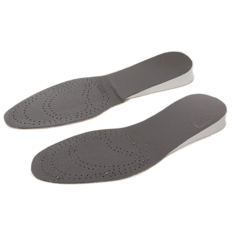 Pair of dark grey cowhide insoles with perforated cushioning and arch