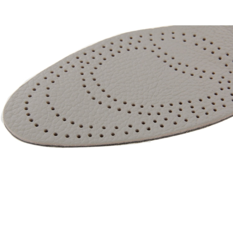 Light grey cowhide insole close-up with perforated dotted comfort pattern