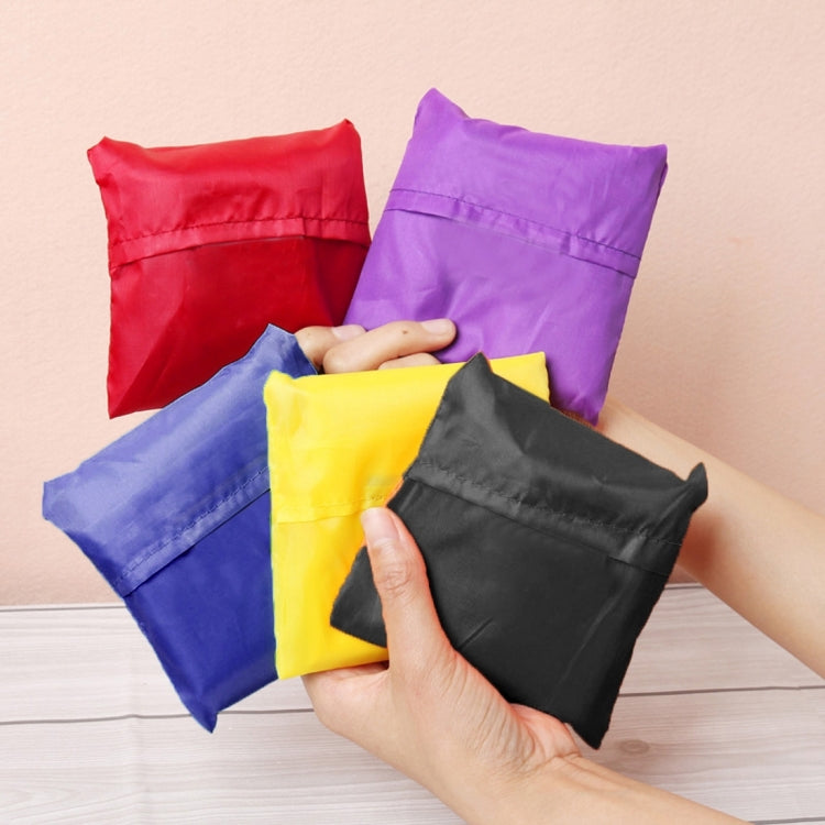 Assorted foldable nylon grocery pouches in red, purple, yellow, blue, and black