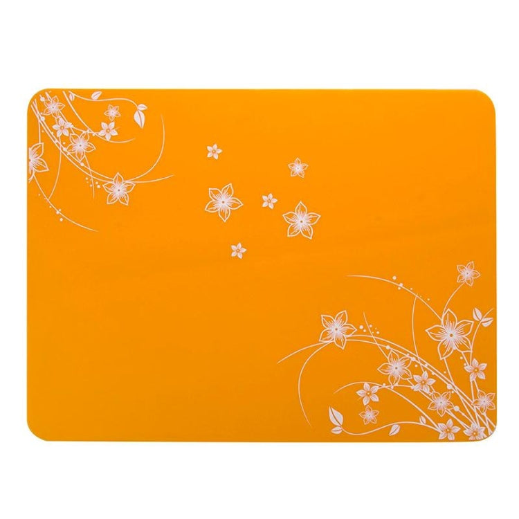 Orange silicone heat-insulation mat with white floral design, 40x30 cm