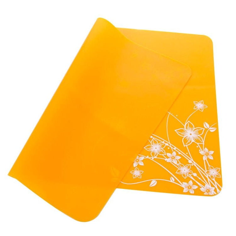 Orange silicone heat-insulation mat with white floral corner design, 40x30 cm