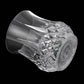 Clear faceted LED light cup close-up, reflective diamond facets on curved sides
