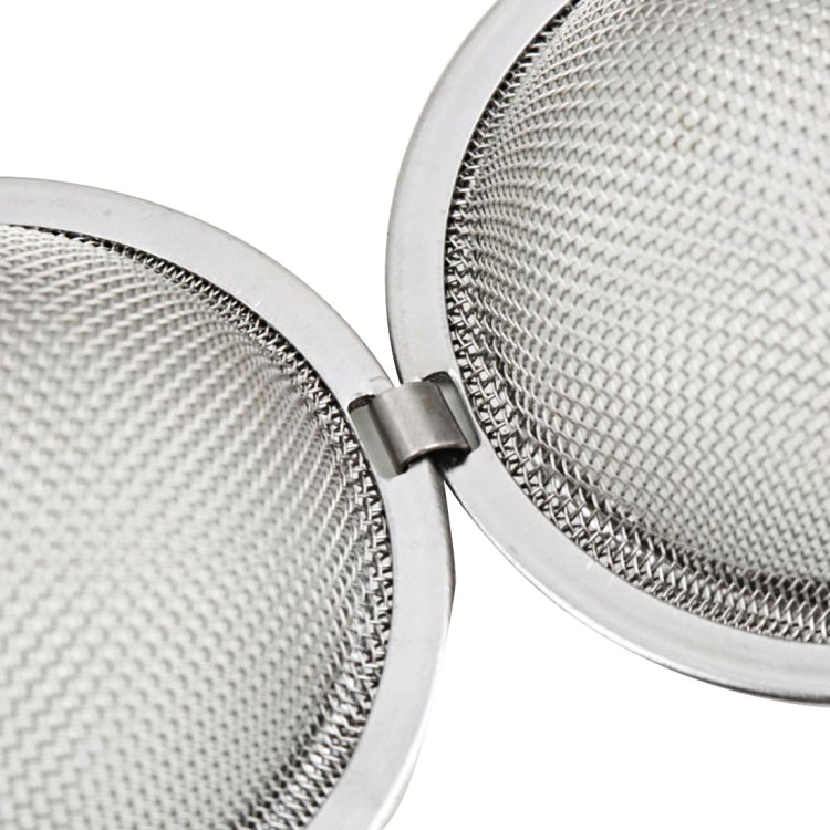 Close-up of stainless steel mesh infuser halves with hinge clasp