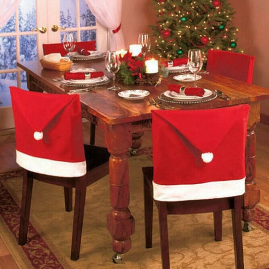 Red and white Christmas chair cover with folded top and white pom-pom accents