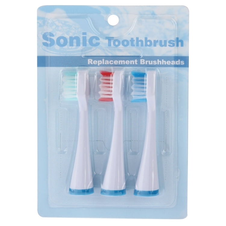 Blister pack showing three replacement brush heads with blue and red bristles