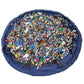 Round blue kids toy storage mat bag with colorful toy bricks inside the center