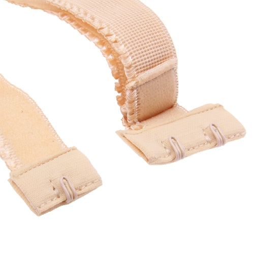Beige bra strap converter close-up with hook-and-loop fastener pieces