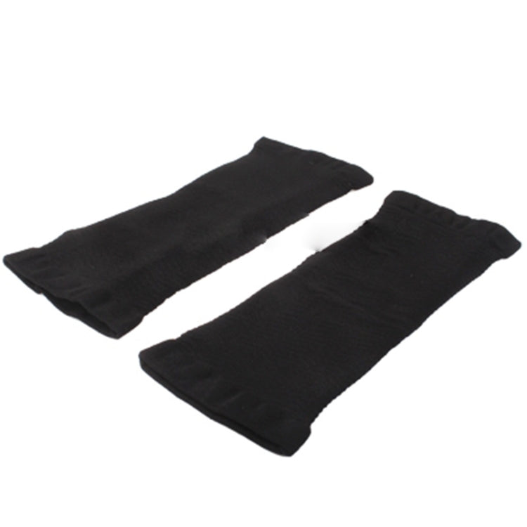 Two black arm shaper sleeves laid flat, open cuffs at one end
