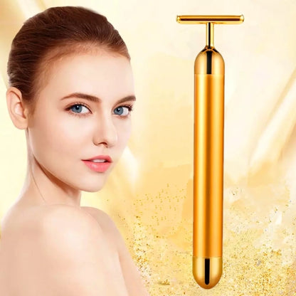 Gold electric face massage stick with T-bar head and smooth cylindrical handle.