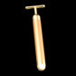 Gold electric face massager stick with T-bar head, angled view and rounded base.