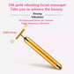 Gold vibrating face massage stick with T-bar head and smooth cylindrical handle.