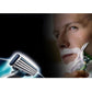 Shaving razor blade refills used on a man's face with white shaving foam