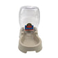 Automatic pet drinking fountain dispenser with clear bottle and beige dish feeder base