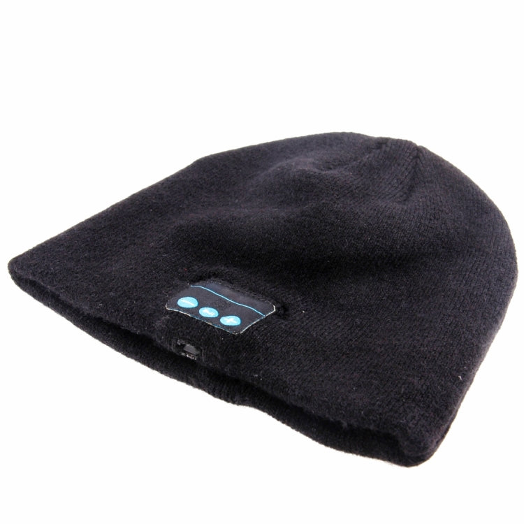 Black knit beanie folded, showing side Bluetooth control buttons