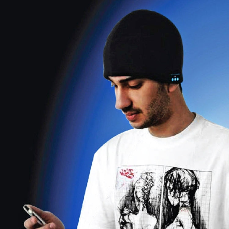 Black knit beanie worn by man with glowing Bluetooth control lights