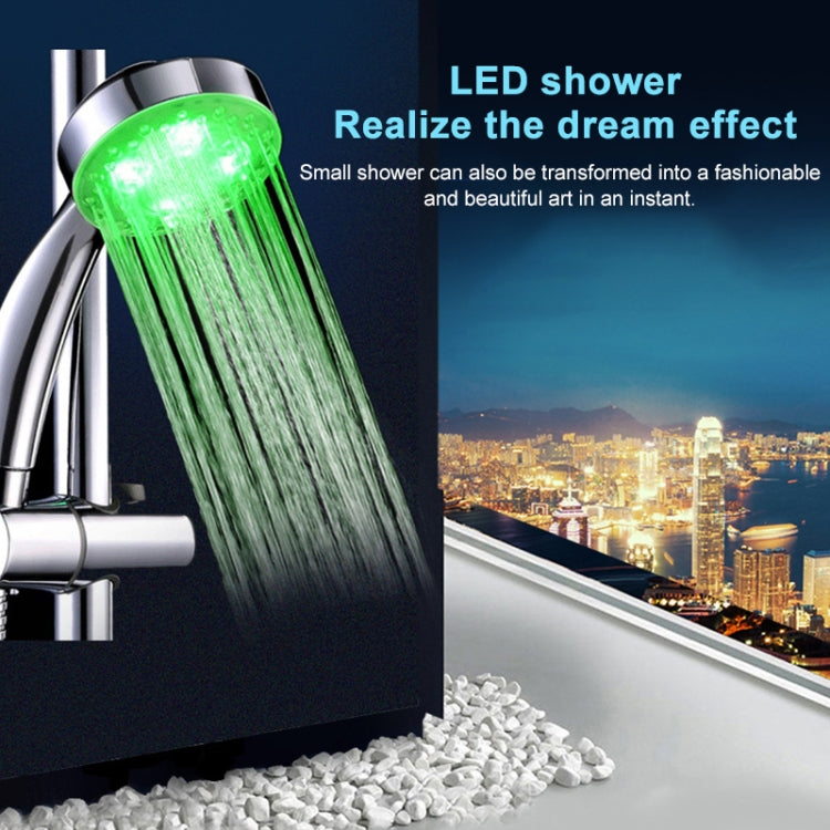 Chrome shower head with green illuminated water stream