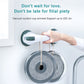 White and dark green suction grab handle, hand holding on a wet tub wall