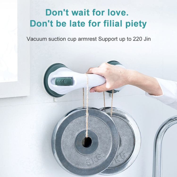 White and dark green suction grab handle, hand holding on a wet tub wall