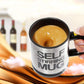 Self-stirring mug filled with hot coffee foam; “SELF STIRRING MUG” logo visible