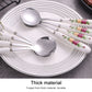 Stainless steel spoon and fork set with white ceramic floral handles