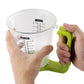 Hands holding green digital measuring cup with LCD weight and cup markings