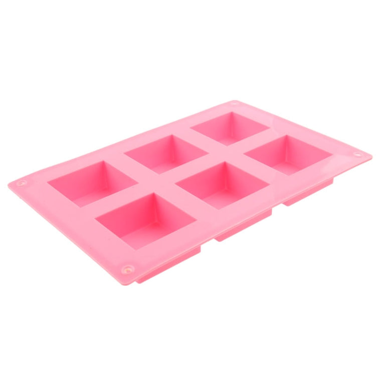 Pink silicone square cake mold with six geometric cavities
