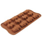 Brown silicone ice cube tray laid at an angle, 12 robot mold cavities