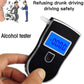 Handheld breath alcohol tester with blue LCD and mouthpiece, held in fingers