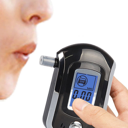 Digital breath alcohol tester close-up with blue LCD reading 0.00, black/silver