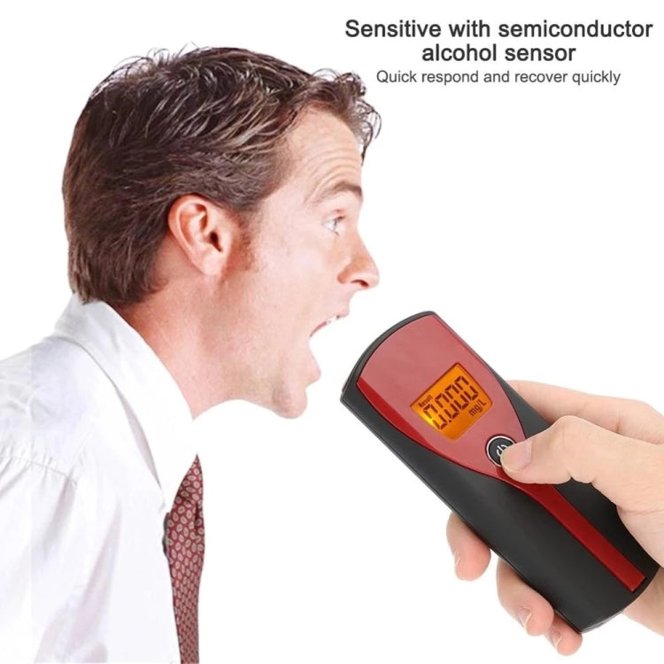 Alcohol breath analyzer in use, orange LCD breath reading on the display