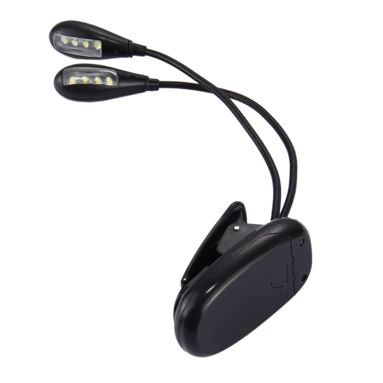 Dual-arm clip-on LED reading light with two illuminated heads and round mounting base