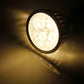 Warm white LED spotlight bulb glowing with round silver reflector