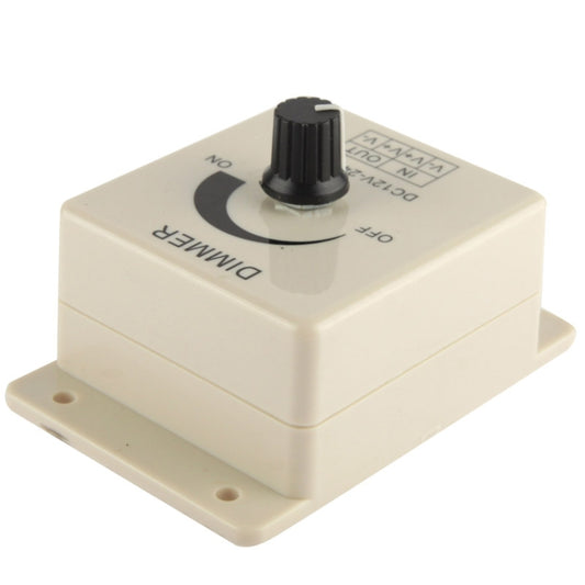 LED dimmer controller top view with black knob and printed ON/OFF dial, cream case.