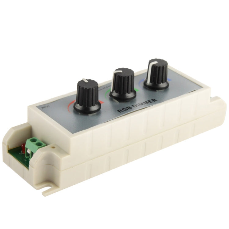 RGB LED dimmer controller with three black rotary knobs on a gray faceplate