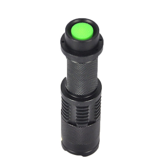 Mini telescopic LED flashlight with green illuminated button and black body