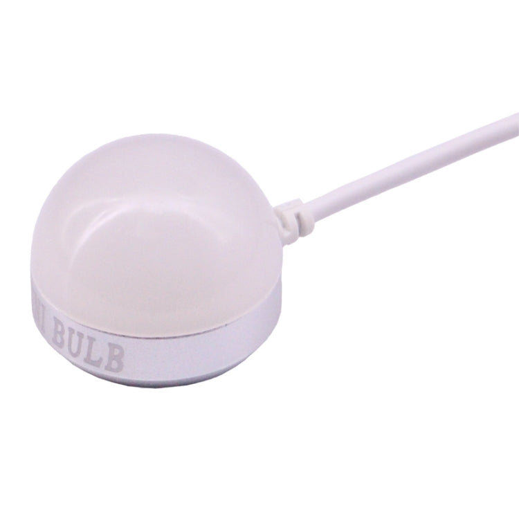 USB mini LED bulb lamp with rounded white bulb head and cable, close-up